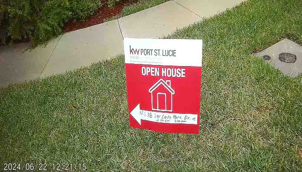 Scummy real estate agent Corinne Lexer violating TownPark rules with her cheap lawn signs